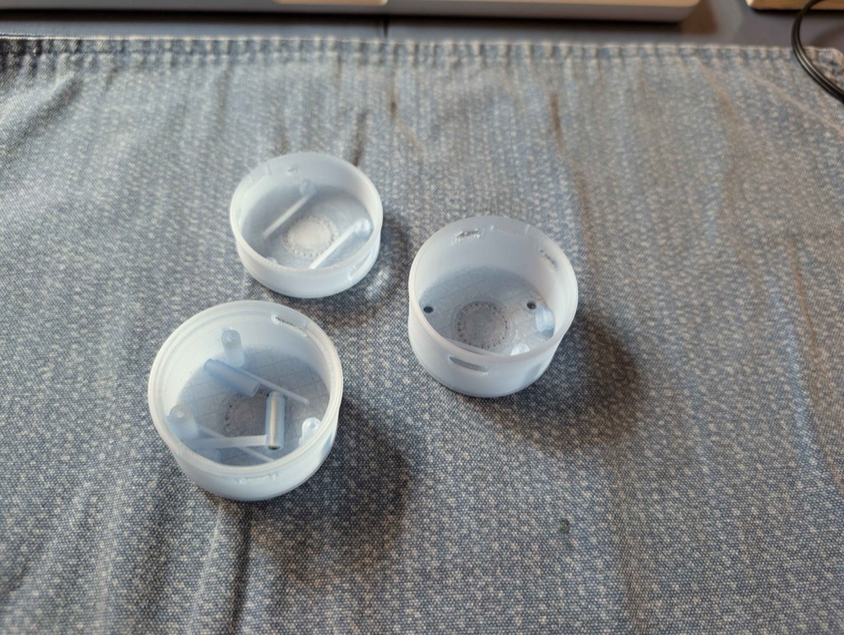 Three failed test prints of the case